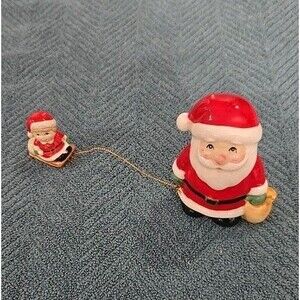 Vintage Enesco Santa Claus  And Kid Pulling on a Sled Ceramic Figurine 3”